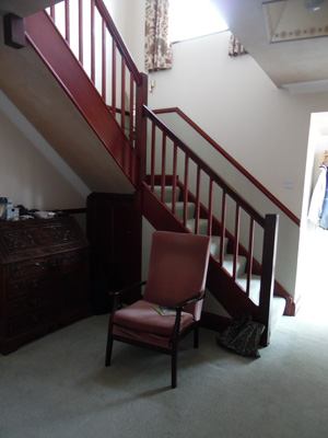Before, showing dark-stained wood